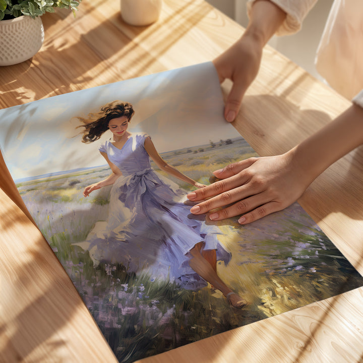 Person holding a print of a woman in a purple dress in a field