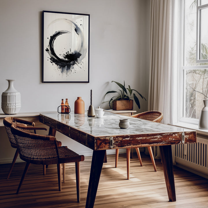 Framed 'Circle of Life' abstract ink art hanging in a cozy, Scandinavian-style dining room interior.
