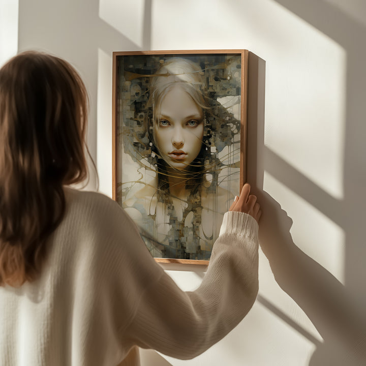 Woman holding framed 'Sudden Insight' fine art print by Papanee Studio – contemporary abstract portrait in soft hues for sophisticated interiors.
