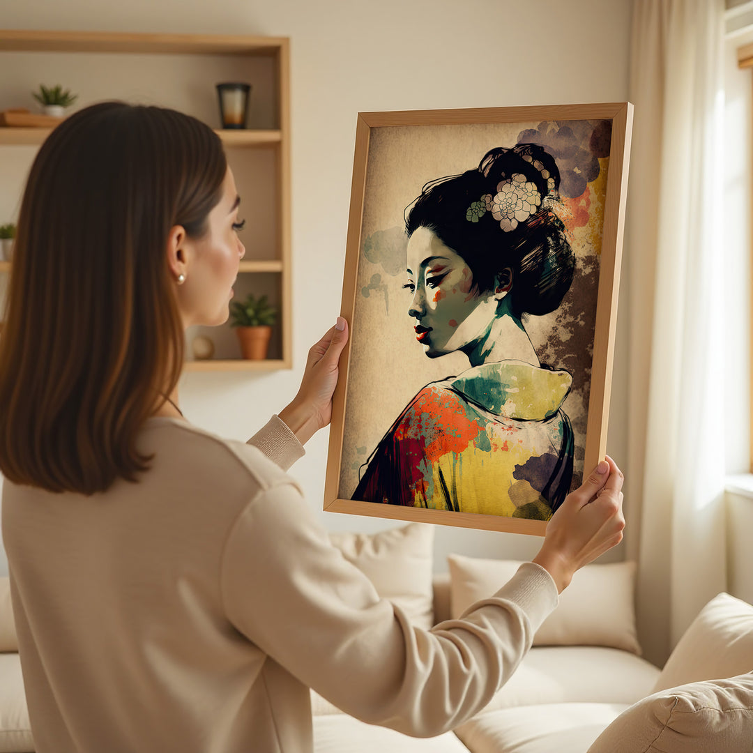 Woman holding Graceful Geisha fine art print by Papanee Studio – abstract Japanese portrait with bold colors, ideal for high-end home decor.